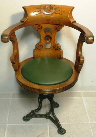 Swivel-chair in mahogany with cast-metal base. Leather seat. Late 19th century.